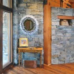 entryway showing stone wall of library and wood posts